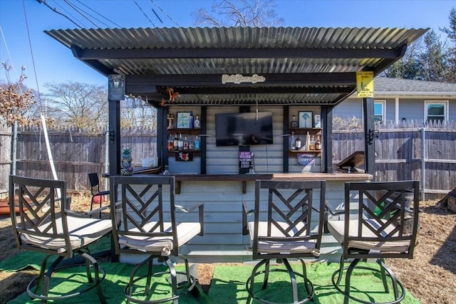 wooden deck featuring fence and outdoor dry bar