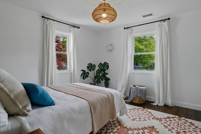13 Kingston St, North Reading, MA 01864 - bedroom featuring multiple windows, wood finished floors, and baseboards