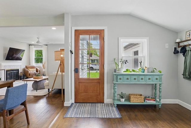 13 Kingston St, North Reading, MA 01864 - foyer entrance with wood finished floors, a glass covered fireplace, baseboards, vaulted ceiling, and a ceiling fan
