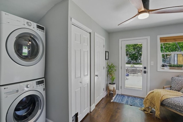 13 Kingston St, North Reading, MA 01864 - laundry area with stacked washer / dryer, dark wood-style flooring, baseboards, and a ceiling fan