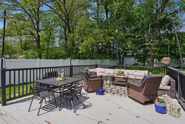 13 Kingston St, North Reading, MA 01864 - deck featuring an outdoor hangout area, outdoor dining space, a fenced backyard, and view of scattered trees