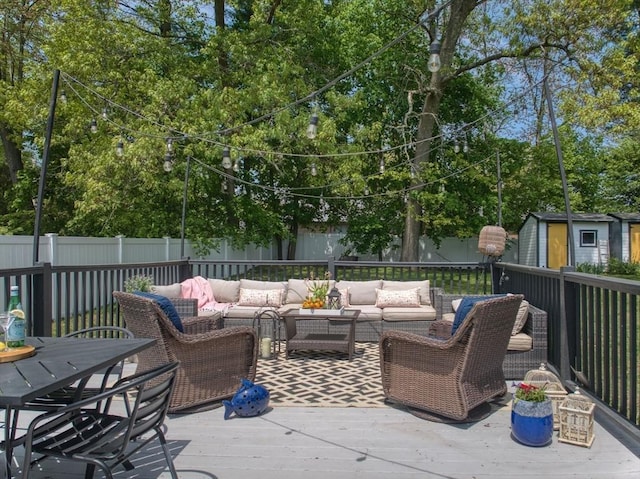 13 Kingston St, North Reading, MA 01864 - fenced backyard featuring an outdoor living space, a wooden deck, and outdoor dining space