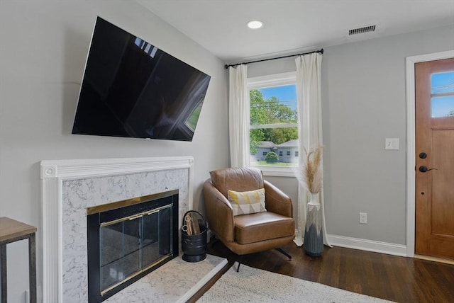 13 Kingston St, North Reading, MA 01864 - living area featuring wood finished floors, baseboards, recessed lighting, and a premium fireplace