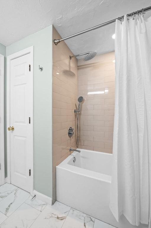full bath with baseboards, shower / bath combination with curtain, and marble finish floor