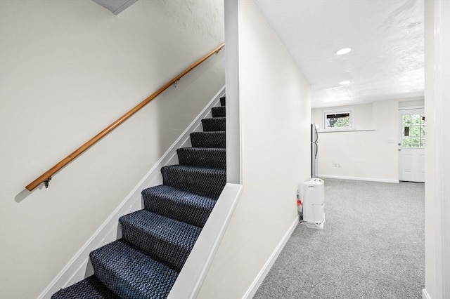 stairway featuring carpet floors, recessed lighting, and baseboards