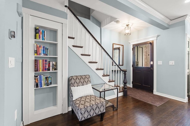 114 Tudor St, Boston, MA 02127 - foyer entrance featuring wood finished floors, baseboards, stairway, crown molding, and a chandelier