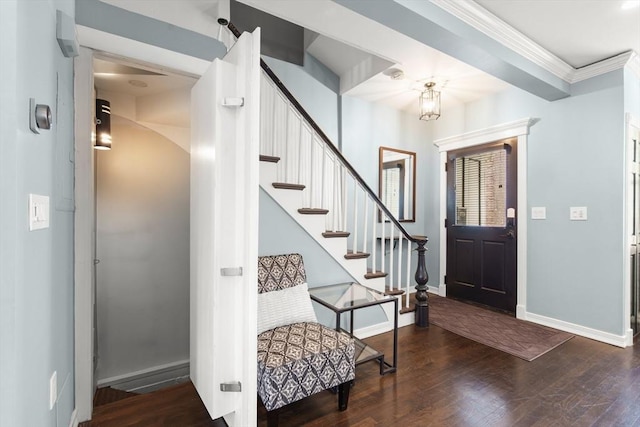 114 Tudor St, Boston, MA 02127 - entrance foyer with wood finished floors, baseboards, stairway, and crown molding