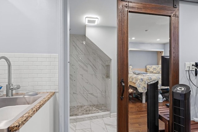 114 Tudor St, Boston, MA 02127 - full bathroom featuring a sink, tiled shower, marble finish flooring, and ensuite bathroom