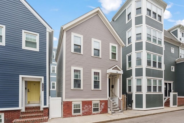 114 Tudor St, Boston, MA 02127 - view of front facade with entry steps and brick siding