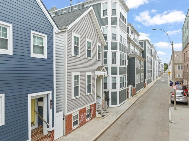 114 Tudor St, Boston, MA 02127 - view of building exterior with a residential view and entry steps