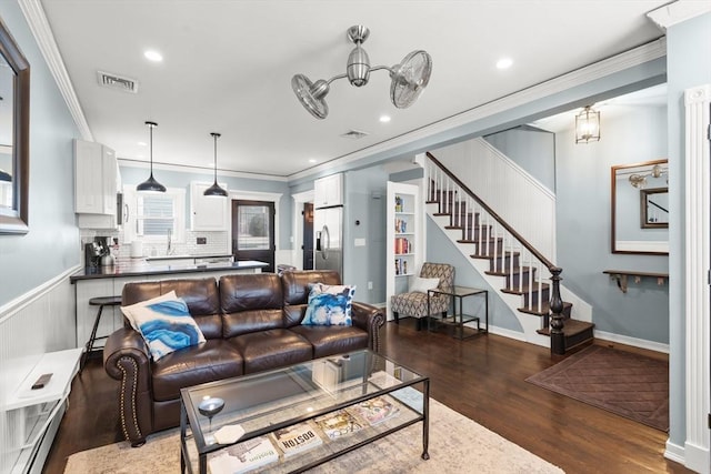 114 Tudor St, Boston, MA 02127 - living room with wood finished floors, crown molding, baseboard heating, stairs, and recessed lighting