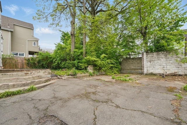 view of yard featuring a patio and fence