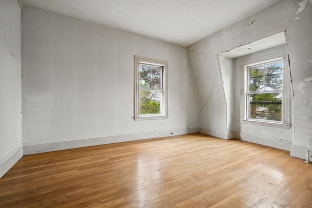 unfurnished room featuring light wood-style flooring