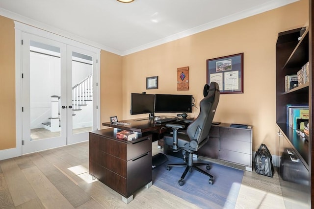 office space with ornamental molding and light wood-type flooring