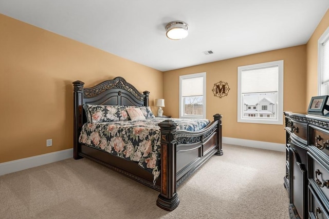 bedroom featuring light carpet