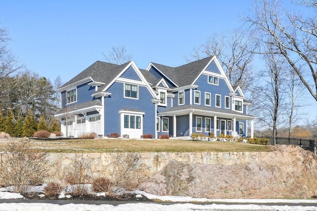 view of front of house featuring a garage and a porch