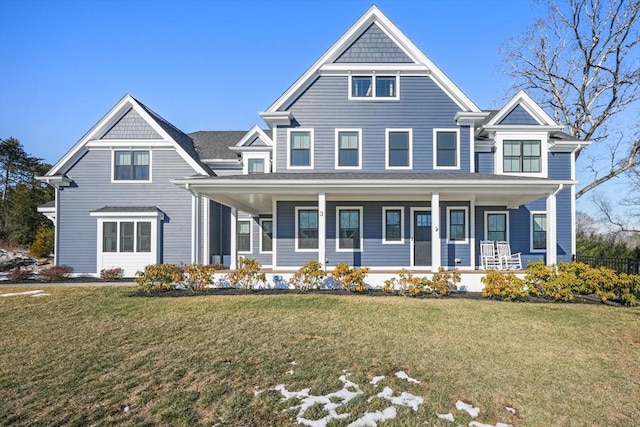 view of front of home featuring covered porch and a front lawn