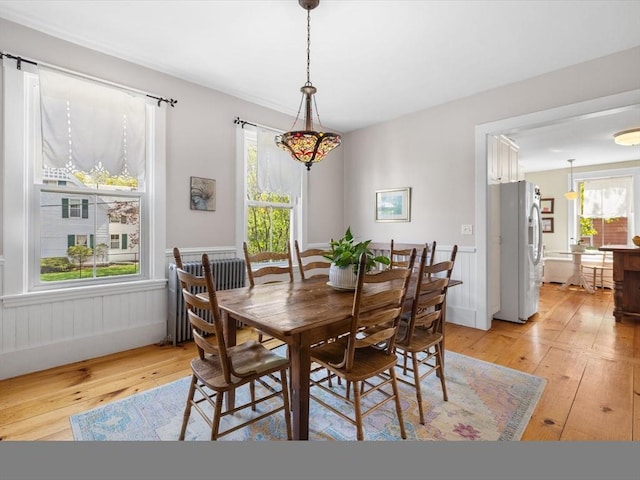 dining space with light wood-style flooring