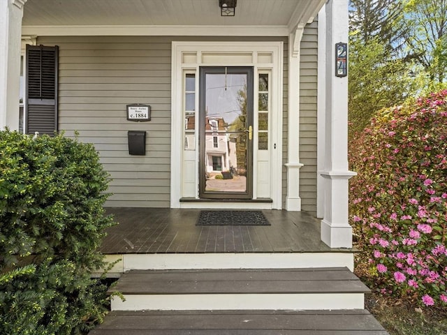 doorway to property featuring covered porch