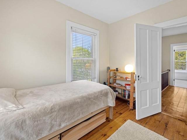 bedroom with wood-type flooring