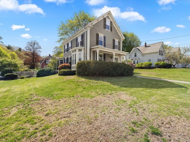 view of property exterior featuring a lawn