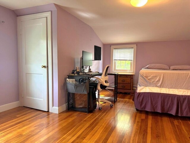 103 Sycamore St, Holbrook, MA 02343 - bedroom with vaulted ceiling, wood finished floors, and baseboards