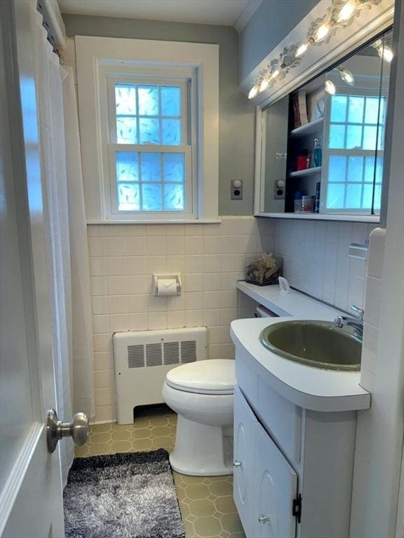 103 Sycamore St, Holbrook, MA 02343 - full bath featuring radiator heating unit, tile walls, vanity, toilet, and tile patterned floors