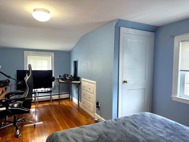 103 Sycamore St, Holbrook, MA 02343 - bedroom featuring a baseboard radiator, hardwood / wood-style floors, lofted ceiling, multiple windows, and an office area