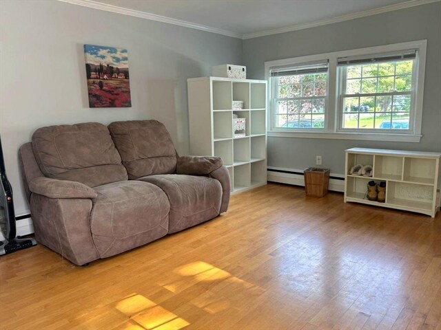 103 Sycamore St, Holbrook, MA 02343 - living area with wood finished floors, crown molding, and a baseboard heating unit