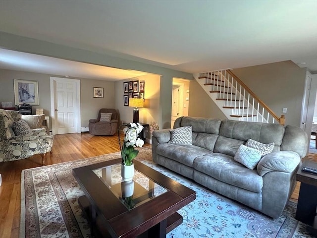 103 Sycamore St, Holbrook, MA 02343 - living area featuring stairway, wood finished floors, baseboard heating, and baseboards