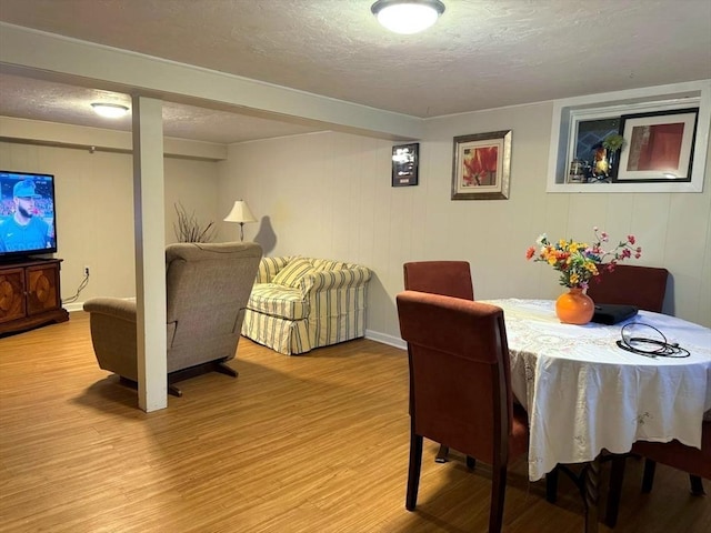 103 Sycamore St, Holbrook, MA 02343 - dining room with light wood-style flooring and a textured ceiling