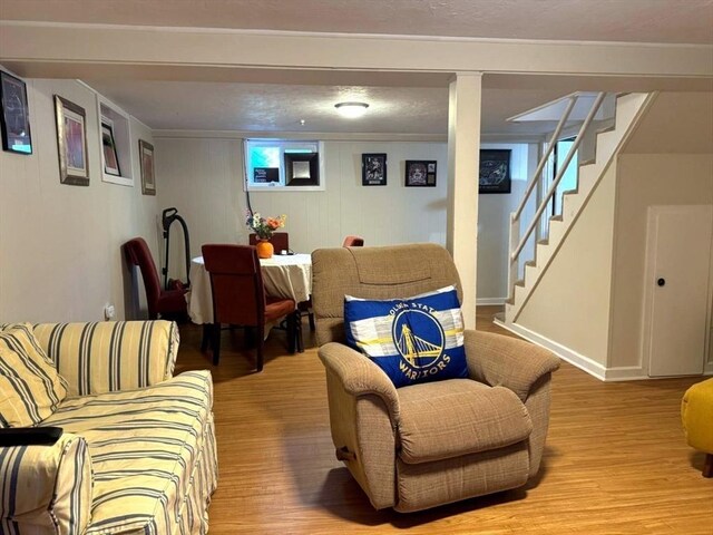 103 Sycamore St, Holbrook, MA 02343 - living room with light wood finished floors, stairway, and baseboards