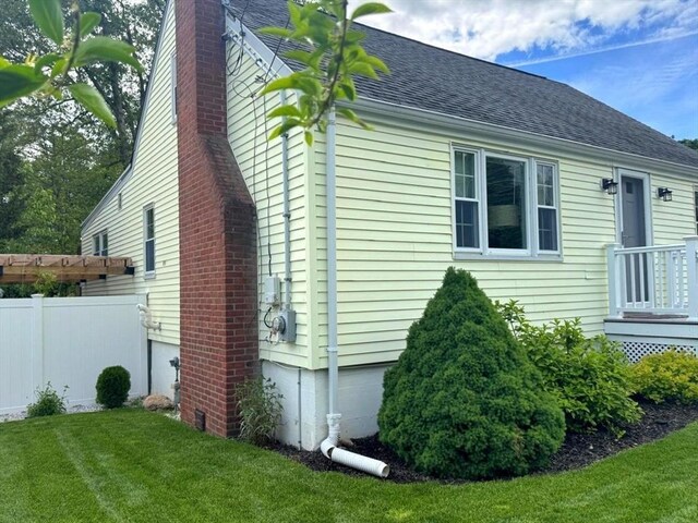 103 Sycamore St, Holbrook, MA 02343 - view of side of property with a chimney and a shingled roof