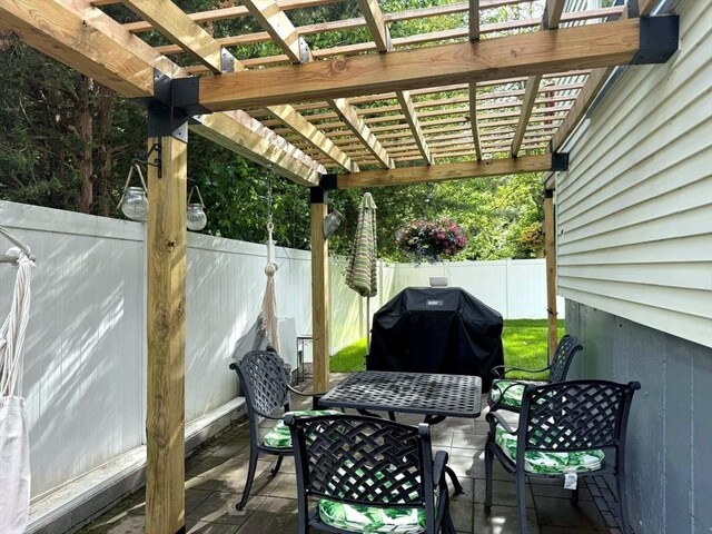 103 Sycamore St, Holbrook, MA 02343 - fenced backyard with a pergola and grilling area