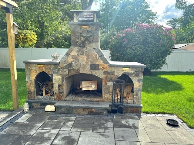 103 Sycamore St, Holbrook, MA 02343 - view of patio / terrace with an outdoor stone fireplace