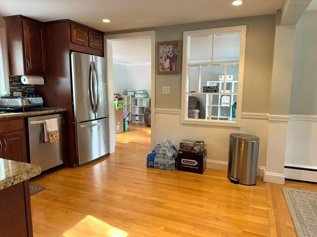 103 Sycamore St, Holbrook, MA 02343 - kitchen with appliances with stainless steel finishes, light wood-style flooring, recessed lighting, tasteful backsplash, and dark brown cabinets
