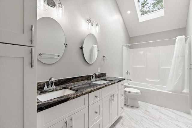 full bathroom with double vanity, lofted ceiling with skylight, a sink, and shower / bathtub combination with curtain