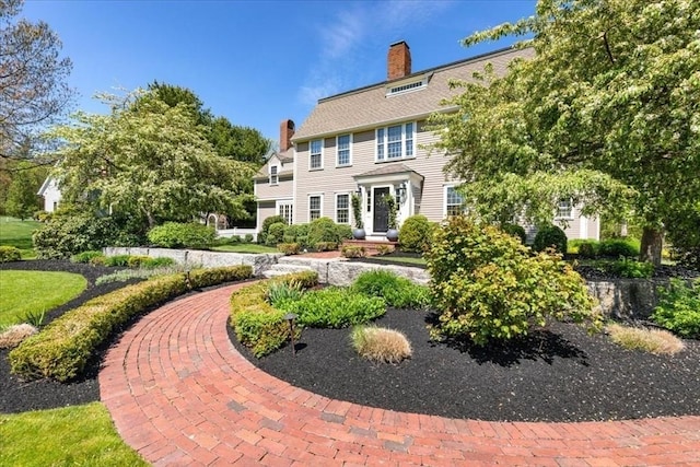 rear view of house with a chimney