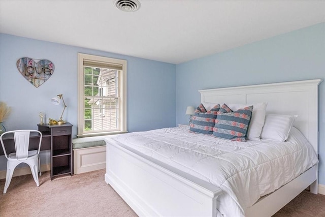 bedroom with light carpet and visible vents