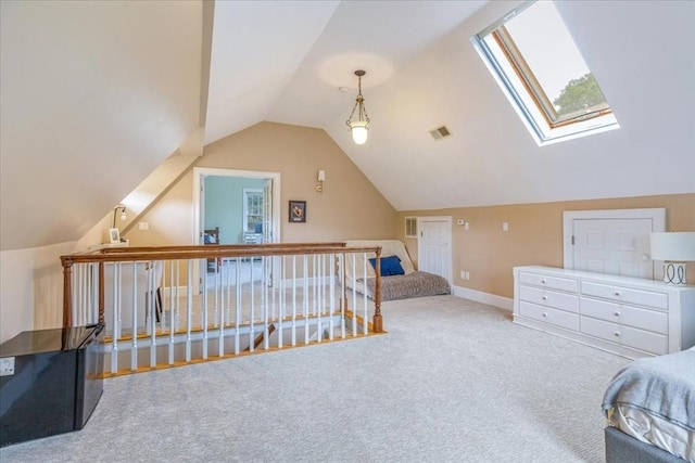 bedroom featuring visible vents, carpet floors, baseboards, and lofted ceiling with skylight