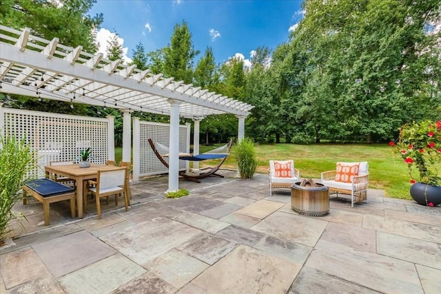 view of patio with a pergola, an outdoor fire pit, and outdoor dining space