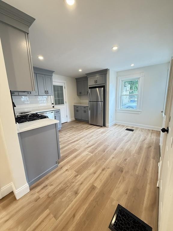 76 Garfield St, Quincy, MA 02169 - kitchen featuring freestanding refrigerator, gray cabinetry, baseboards, light countertops, and recessed lighting