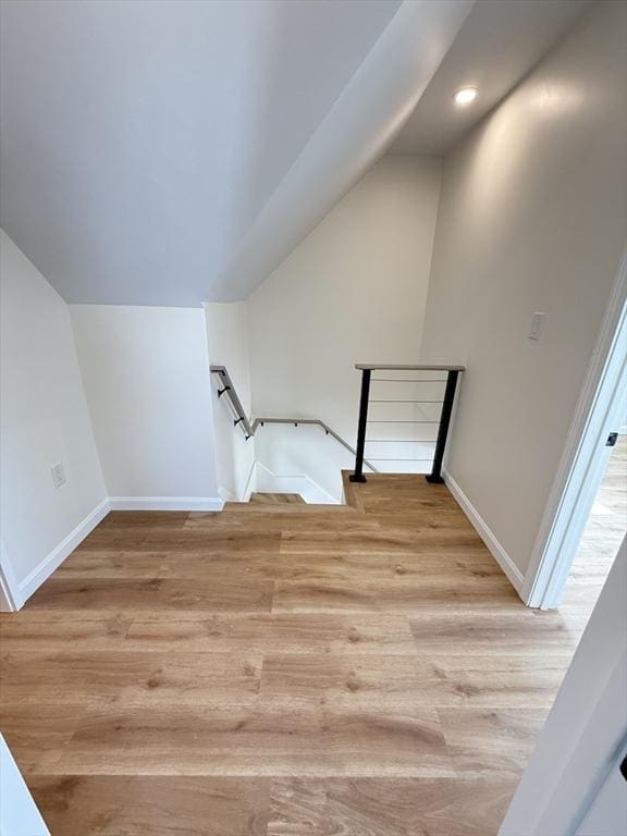 76 Garfield St, Quincy, MA 02169 - stairway with lofted ceiling, wood finished floors, baseboards, and recessed lighting