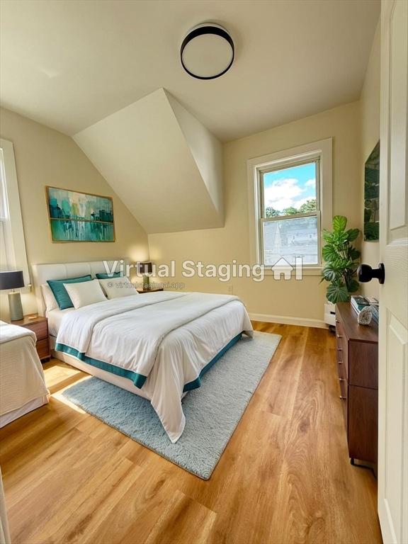 76 Garfield St, Quincy, MA 02169 - bedroom with wood finished floors, baseboards, and vaulted ceiling