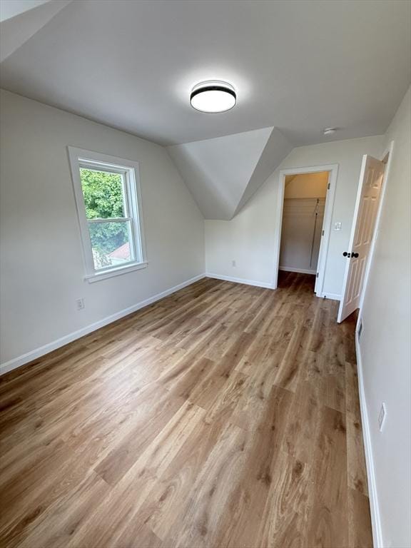 76 Garfield St, Quincy, MA 02169 - additional living space featuring wood finished floors, vaulted ceiling, and baseboards