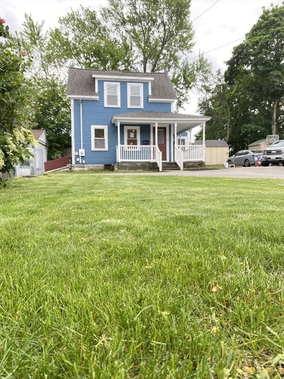 76 Garfield St, Quincy, MA 02169 - view of front of property with covered porch, a front lawn, and roof with shingles