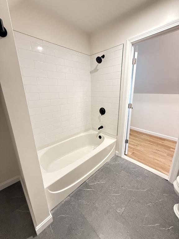 76 Garfield St, Quincy, MA 02169 - full bathroom with shower / washtub combination, toilet, and baseboards