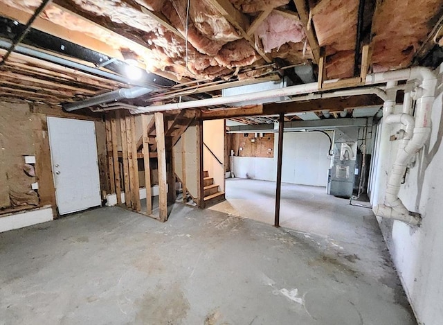 31 Harvard Ct, Dracut, MA 01826 - unfinished basement featuring heating unit and stairway