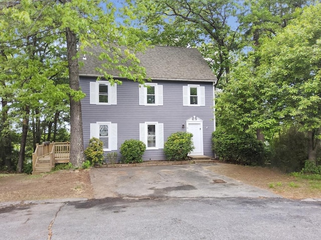 31 Harvard Ct, Dracut, MA 01826 - colonial home with roof with shingles and a wooden deck