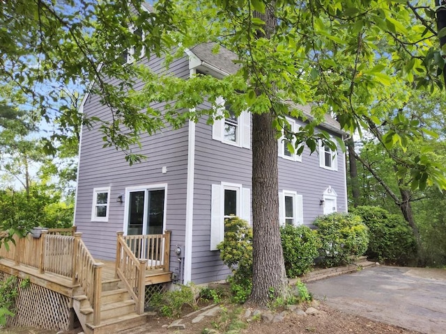31 Harvard Ct, Dracut, MA 01826 - rear view of house with a deck and a patio area